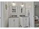 Bathroom featuring double vanities and modern fixtures at 160 Isleworth Way, Fayetteville, GA 30215