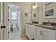 Bathroom featuring double vanities and modern fixtures at 160 Isleworth Way, Fayetteville, GA 30215