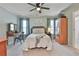 Bedroom with a comfortable bed, natural light, and calming color palette at 160 Isleworth Way, Fayetteville, GA 30215