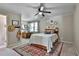 Bedroom with neutral paint, light, and decor at 160 Isleworth Way, Fayetteville, GA 30215