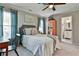 Bedroom with a comfortable bed, natural light, and calming color palette at 160 Isleworth Way, Fayetteville, GA 30215