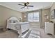 Comfortable bedroom with a queen-size bed, neutral decor, and ample natural light from the window at 160 Isleworth Way, Fayetteville, GA 30215