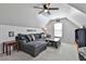 Bonus room with vaulted ceiling, storage shelves, and comfortable seating at 160 Isleworth Way, Fayetteville, GA 30215
