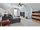 Bonus room with vaulted ceiling, storage shelves, and comfortable seating at 160 Isleworth Way, Fayetteville, GA 30215
