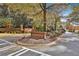 The Whitewater Creek neighborhood entrance with brick signage and well-maintained landscaping at 160 Isleworth Way, Fayetteville, GA 30215