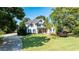 Beautiful home showcasing a well-manicured lawn and inviting curb appeal at 160 Isleworth Way, Fayetteville, GA 30215