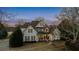 Beautiful two-story home featuring manicured lawn and stone accents at 160 Isleworth Way, Fayetteville, GA 30215