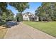 Gorgeous home with a large front lawn and mature landscaping at 160 Isleworth Way, Fayetteville, GA 30215
