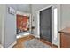 Spacious foyer boasts hardwood floors, a decorative rug, and a glimpse into a cozy living room at 160 Isleworth Way, Fayetteville, GA 30215