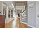 Grand two-story foyer with hardwood floors, staircase and views into the living spaces at 160 Isleworth Way, Fayetteville, GA 30215