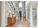 Bright foyer features hardwood floors, staircase, traditional furnishings, and large windows at 160 Isleworth Way, Fayetteville, GA 30215