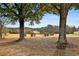 Serene view of the golf course showcasing mature trees and rolling fairways at 160 Isleworth Way, Fayetteville, GA 30215