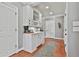 Elegant butler's pantry with white cabinetry and granite countertops at 160 Isleworth Way, Fayetteville, GA 30215