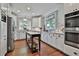 Spacious kitchen featuring stainless steel appliances, white cabinets, and a center island at 160 Isleworth Way, Fayetteville, GA 30215