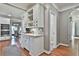 Bright eat-in kitchen area with wooden floors, cabinetry, and stainless steel appliances at 160 Isleworth Way, Fayetteville, GA 30215