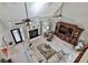 Bright living room featuring a fireplace, ceiling fan, and neutral color scheme at 160 Isleworth Way, Fayetteville, GA 30215
