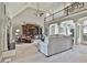 Spacious living area with a fireplace, vaulted ceiling and a view of the second floor at 160 Isleworth Way, Fayetteville, GA 30215