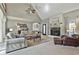 Inviting living room featuring a fireplace, vaulted ceilings and comfortable seating at 160 Isleworth Way, Fayetteville, GA 30215