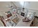 Bright living room featuring a fireplace, ceiling fan, and comfortable seating at 160 Isleworth Way, Fayetteville, GA 30215