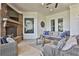 Patio featuring a stone fireplace, comfortable seating, and a ceiling with fans and recessed lighting at 160 Isleworth Way, Fayetteville, GA 30215