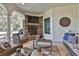 Outdoor patio featuring a stone fireplace and comfortable seating, perfect for relaxing and entertaining at 160 Isleworth Way, Fayetteville, GA 30215