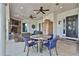 Outdoor patio with a stone fireplace, comfortable seating, and a ceiling with recessed lighting at 160 Isleworth Way, Fayetteville, GA 30215