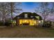 Expansive backyard featuring an outdoor kitchen, covered patio, and lush green space perfect for entertaining at 160 Isleworth Way, Fayetteville, GA 30215
