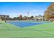 Well-maintained tennis court is perfect for an active lifestyle in the community at 160 Isleworth Way, Fayetteville, GA 30215