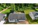 Aerial view of a home with a large, fenced backyard and mature trees at 2677 Tilson Rd, Decatur, GA 30032