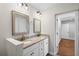Bright bathroom featuring double vanity, granite countertop, and modern lighting at 2677 Tilson Rd, Decatur, GA 30032