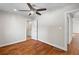 Bedroom featuring hardwood floors, neutral paint, ceiling fan and ensuite bathroom at 2677 Tilson Rd, Decatur, GA 30032