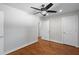 Bedroom featuring hardwood floors, ceiling fan, and neutral color palette at 2677 Tilson Rd, Decatur, GA 30032