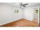 Bright bedroom with ceiling fan, hardwood floors, and natural light from window at 2677 Tilson Rd, Decatur, GA 30032