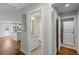 Hallway with laundry area, bathroom, and view of kitchen with island at 2677 Tilson Rd, Decatur, GA 30032