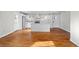 Open-concept main living area featuring hardwood floors and access to the updated kitchen at 2677 Tilson Rd, Decatur, GA 30032
