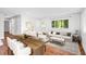 Stylish living room with hardwood floors, modern furnishings, and shiplap wall at 2677 Tilson Rd, Decatur, GA 30032