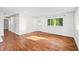 Bright, open living space with hardwood floors, large windows, and shiplap accent wall at 2677 Tilson Rd, Decatur, GA 30032