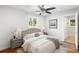 Bedroom featuring stylish furniture, ceiling fan, and ensuite bathroom at 2677 Tilson Rd, Decatur, GA 30032