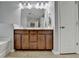 Bathroom featuring double sinks and cabinet with large mirror and lighting at 3351 Vintage Se Cir, Smyrna, GA 30080