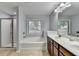 Bathroom featuring a separate glass-enclosed shower and tub with double vanity sinks at 3351 Vintage Se Cir, Smyrna, GA 30080