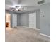 Bedroom featuring gray walls, carpet, ceiling fan, and access to the bathroom at 3351 Vintage Se Cir, Smyrna, GA 30080