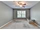Spacious bedroom featuring neutral paint, carpet flooring and ceiling fan for optimal comfort at 3351 Vintage Se Cir, Smyrna, GA 30080