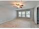 Bedroom with a ceiling fan and three windows providing natural light at 3351 Vintage Se Cir, Smyrna, GA 30080