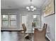 Bright dining room with hardwood floors and view of rear of property at 3351 Vintage Se Cir, Smyrna, GA 30080