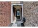 Close-up of a brick townhome entrance with a classic black front door and white trim at 3351 Vintage Se Cir, Smyrna, GA 30080