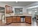 Open kitchen view with stainless appliances, breakfast bar, and hardwood flooring at 3351 Vintage Se Cir, Smyrna, GA 30080