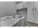 Well-equipped laundry room with washer, dryer, and plenty of storage space at 3351 Vintage Se Cir, Smyrna, GA 30080