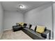 Living room showcasing a comfortable black leather sofa with accent pillows and neutral carpet at 3351 Vintage Se Cir, Smyrna, GA 30080