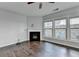 Cozy living room with fireplace and hardwood floors and large windows at 3351 Vintage Se Cir, Smyrna, GA 30080