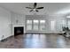 Bright living room with hardwood floors, a fireplace, and large windows providing natural light at 3351 Vintage Se Cir, Smyrna, GA 30080